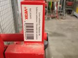a red hand truck with a barcode on the back of it