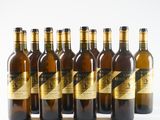 six bottles of wine sitting next to each other on a white surface
