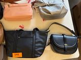 many bags and purses on a table in a store