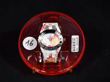 a watch in a red case on a black surface