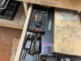 a drawer full of tools that are sitting on a table