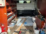 an image of a van with tools in the back of it