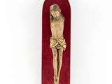a wooden crucifix with a red velvet case