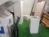 an image of a room with a refrigerator and a refrigerator freezer