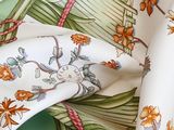 a close up of a floral print on a white cloth