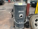 an image of a machine that is in a garage
