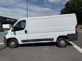 a picture of a white van parked in a parking lot