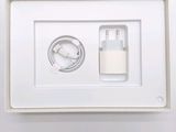 a picture of a white box with a charger and a cable