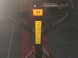 a scooter that is sitting on the floor in the room