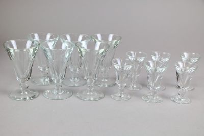 a lot of wine glasses that are sitting on a table