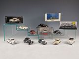 a lot of toy cars that are sitting on a shelf