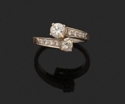 an 18k gold and diamond bypass ring