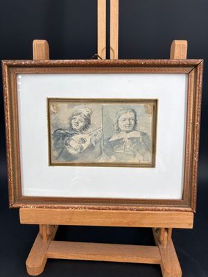 une photo d'un tableau représentant un homme et une femme, posé sur un chevalet