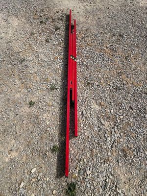 a red piece of equipment laying on the ground