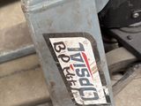 a close up of a pair of shoes that are on top of a machine