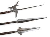 four different types of knives are displayed on a white surface