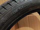 a close up of a tire on a box with a box in the background