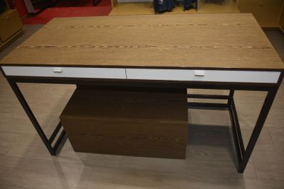 an image of a desk with a drawer underneath it