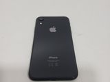 a close up of a black iphone sitting on top of a white table