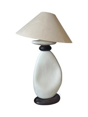 an image of a white lamp with a beige shade on it