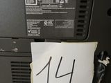 a piece of paper taped to the back of a laptop