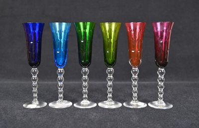 six different colored wine glasses lined up in a row