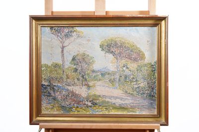 an oil painting of a landscape with trees on a easel
