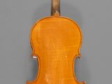 an old violin with a wooden back and a wooden bow