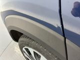 a close up of a car ' s tire with a hole in the tire