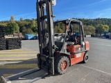 a forklift that is parked in a parking lot