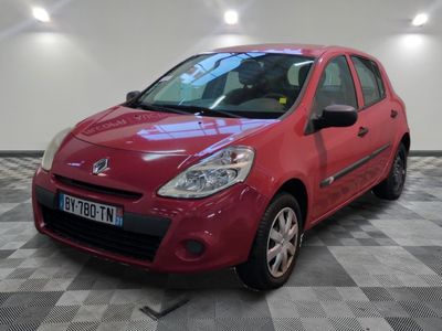 a picture of a red car parked in a garage