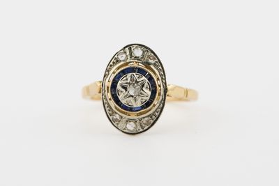 Bague ovale Art Déco En or jaune et blanc 18 K (750‰) orné d…