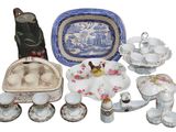 many different pieces of china on display on the table