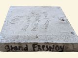 a stone block with writing on it that says grand frosty