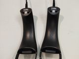 two black handles that are connected to a cord