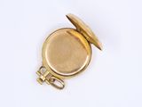 an image of a gold pocket watch on a white surface