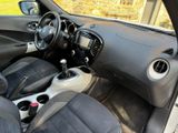 the interior of a small car with a steering control and dashboard