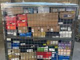 a metal cart with many boxes on it in a warehouse