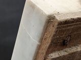 a close up of a piece of wood on the water