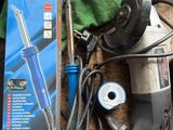 a box of tools sitting on a table next to a pair of scissors
