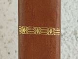 a brown book that is sitting on a table