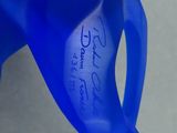 a close up of a blue vase with writing on it