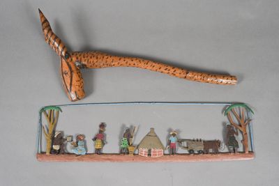 a small figurine of people and animals on a shelf