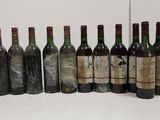 several bottles of wine are lined up in a row
