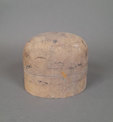 a small wooden box sitting on a gray surface