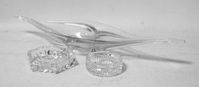 a glass spoon and a glass bowl on a table