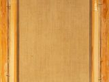an old wooden frame with a picture hanging on the wall