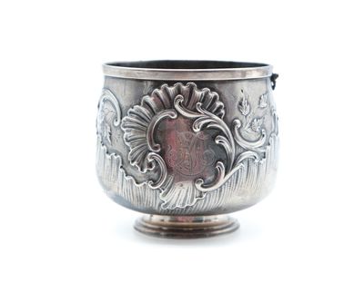 a silver cup with a design on it on a white surface