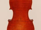 an old violin with a wooden back and a long neck