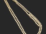 un collier de perles à un rang avec un fermoir en diamant